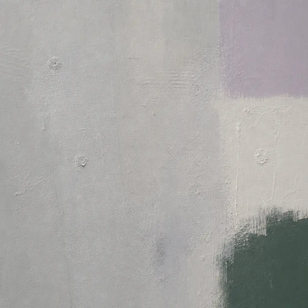Close-up of layered paint on a repainted gallery wall